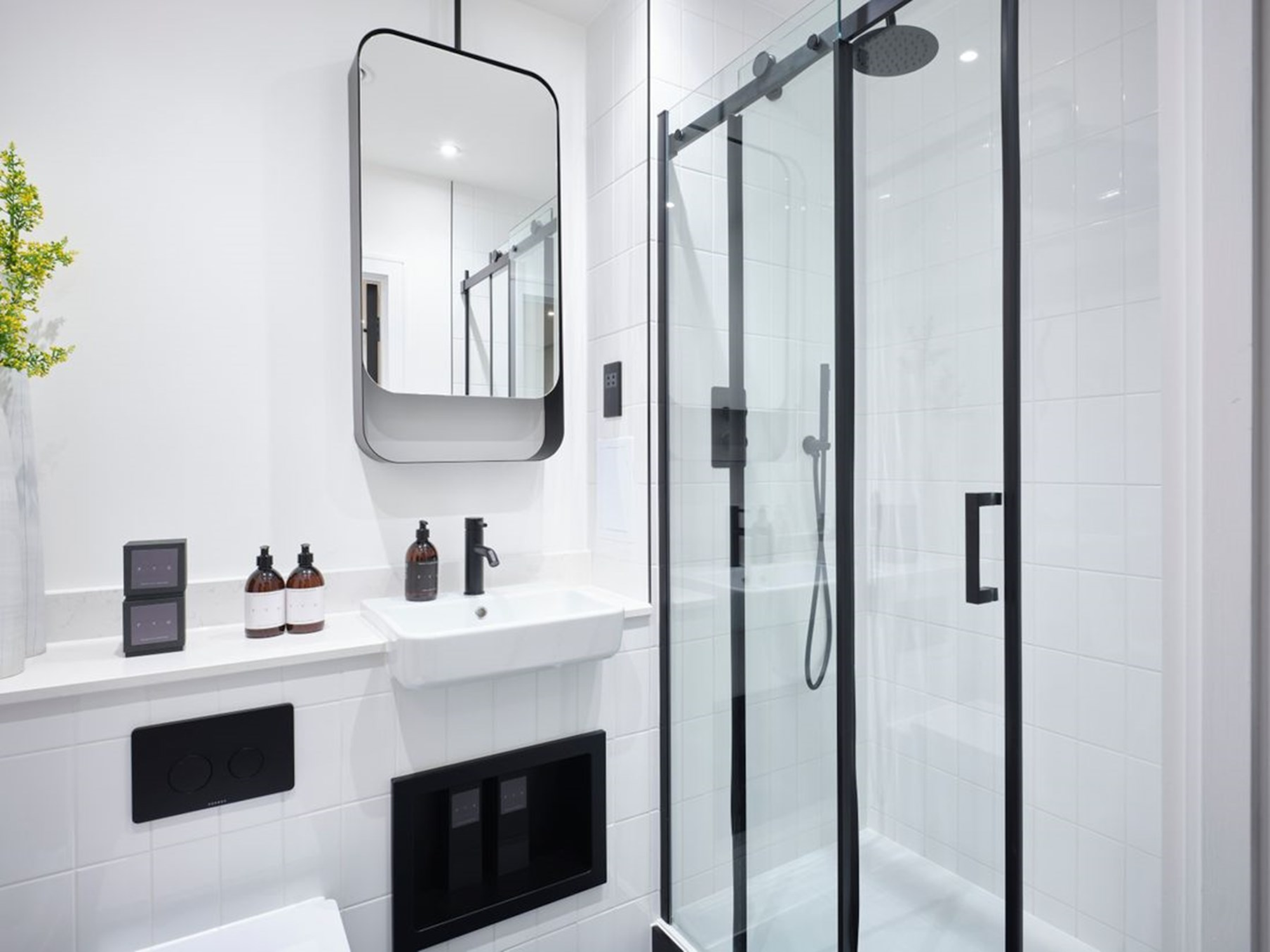 Saneux Bathroom at Alphabet featuring Volato mirror