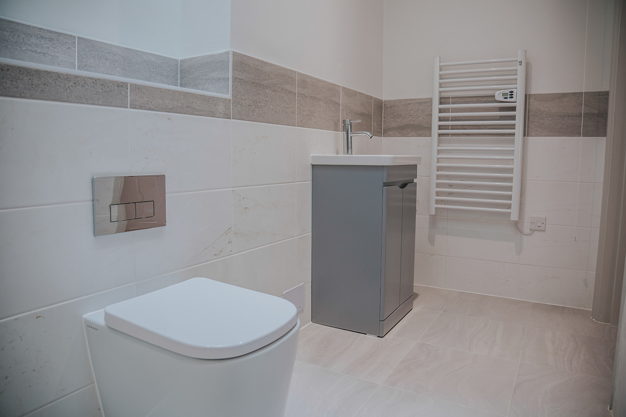 Saneux Matteo back to wall toilet, Indigo basin and unit. and Flushe 2.0 concealed cistern and flush plate in Bignold House