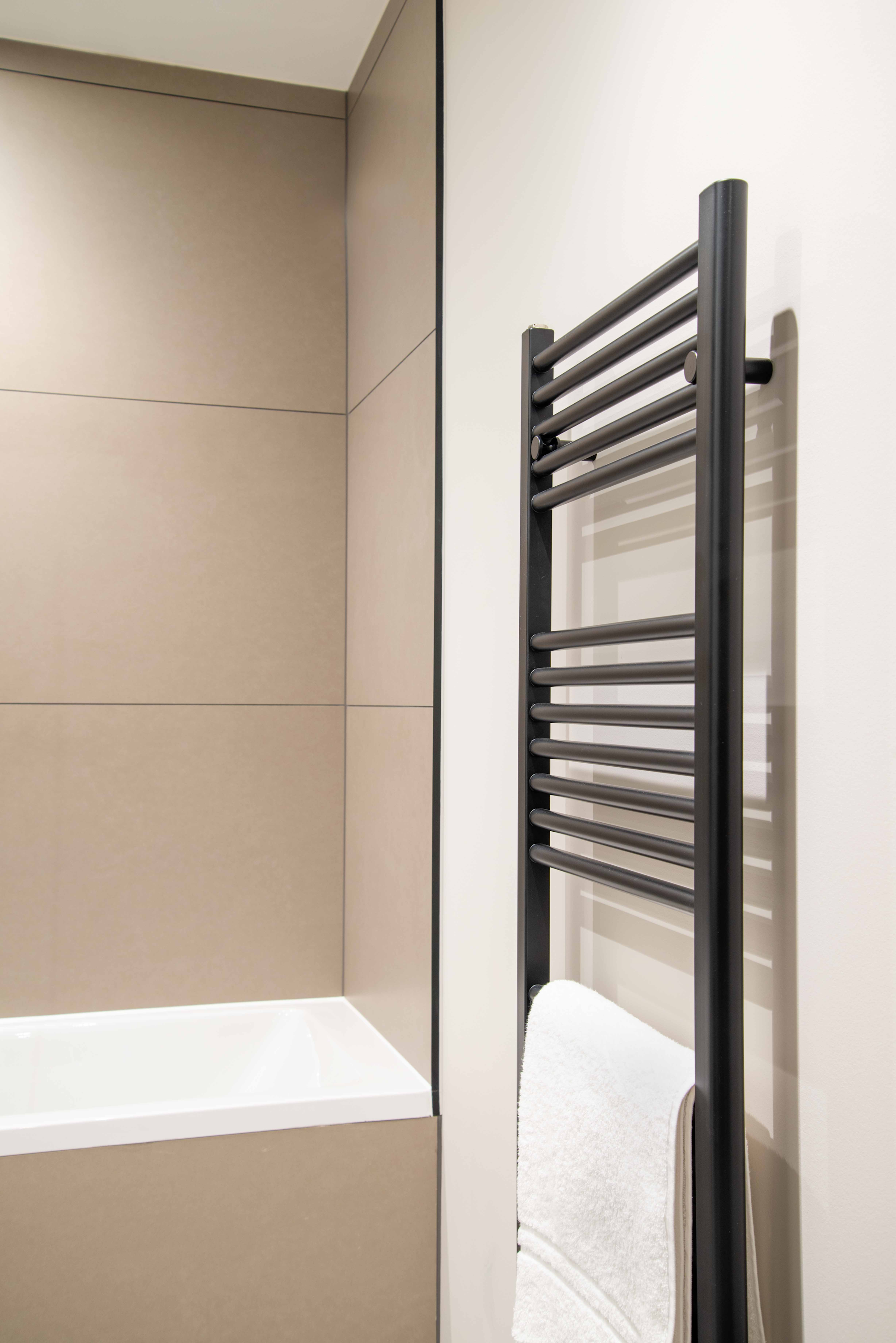Saneux towel rail matte black at Rubric Apartments, Whetstone