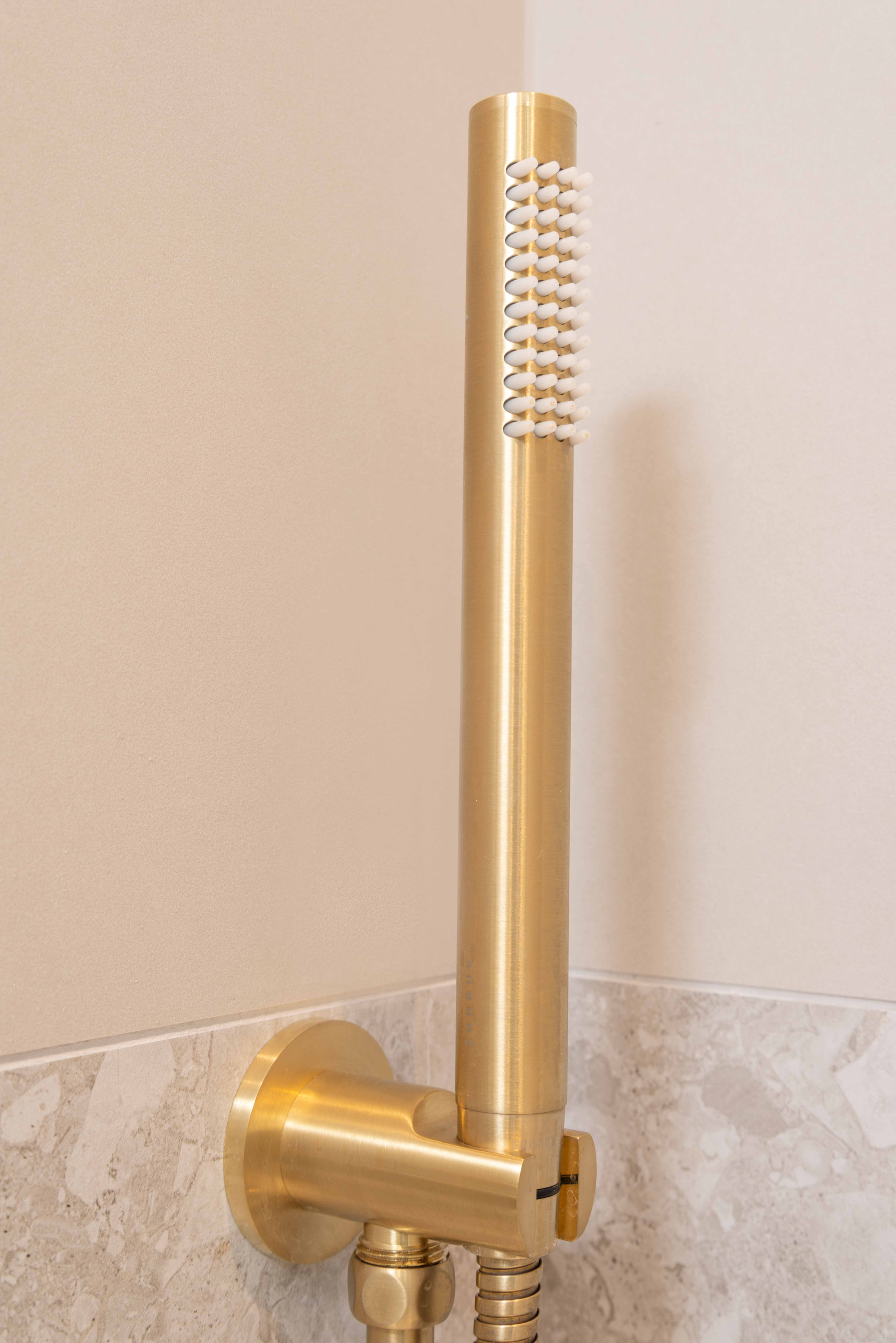Saneux Cos shower handset brushed brass at Rubric Apartments, Whetstone